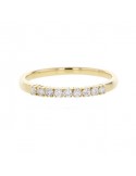 Claw set diamond wedding ring in 18 K gold