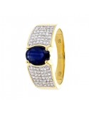 Large ring with sapphire sided with diamonds in 18 K gold