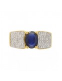 Large ring with sapphire sided with diamonds in 18 K gold